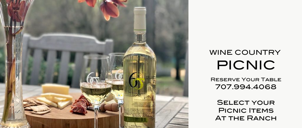 A picnic with a bottle of white wine at Six Sigma Ranch