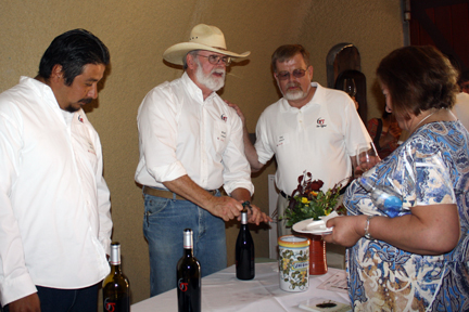 Tony, Walt and Kaj serving wine in the cave