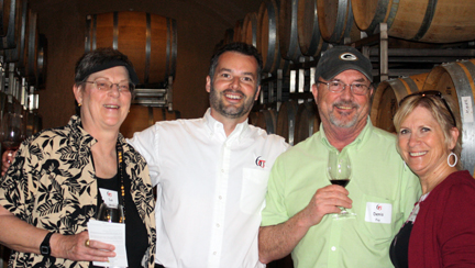 Guests enjoy wine in the cave with winemaker Matt